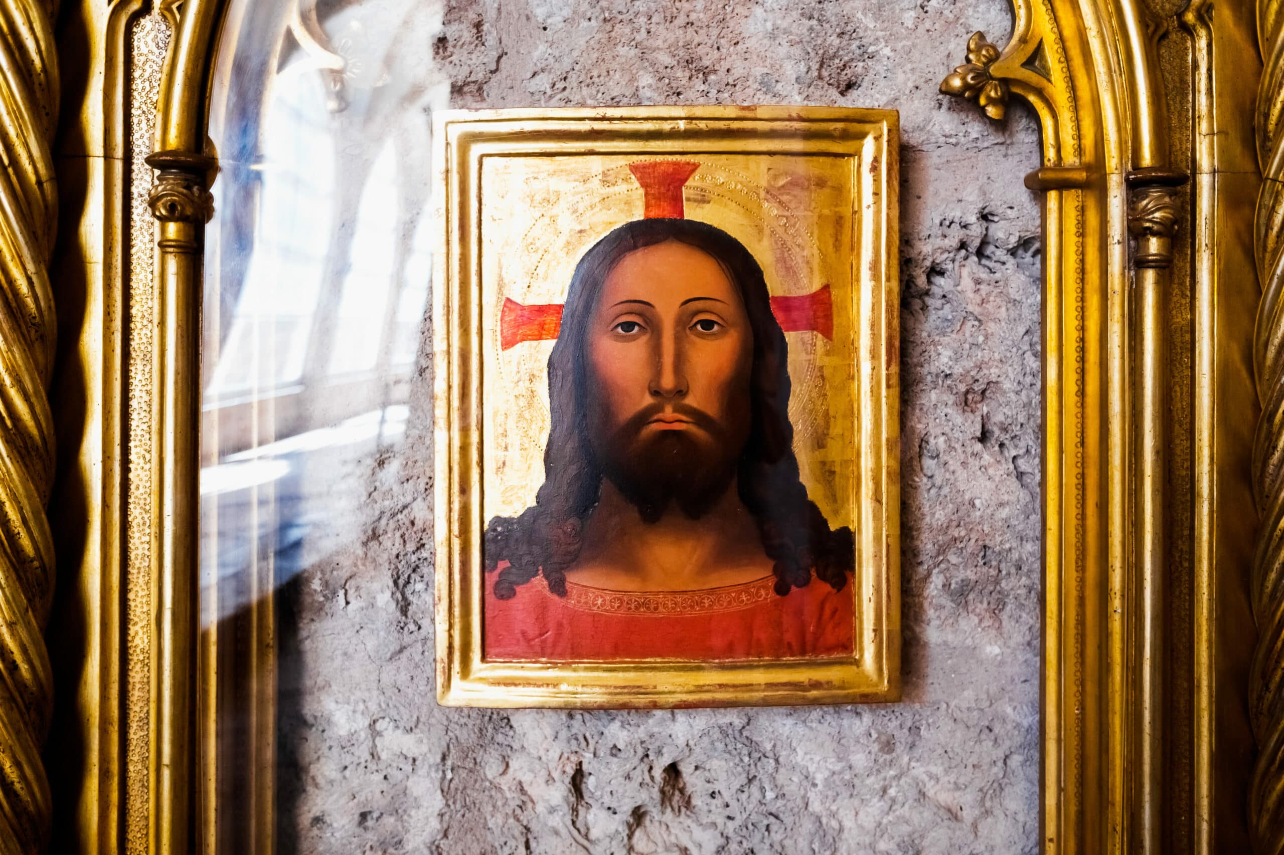 drawing of the face of Christ in an old painting